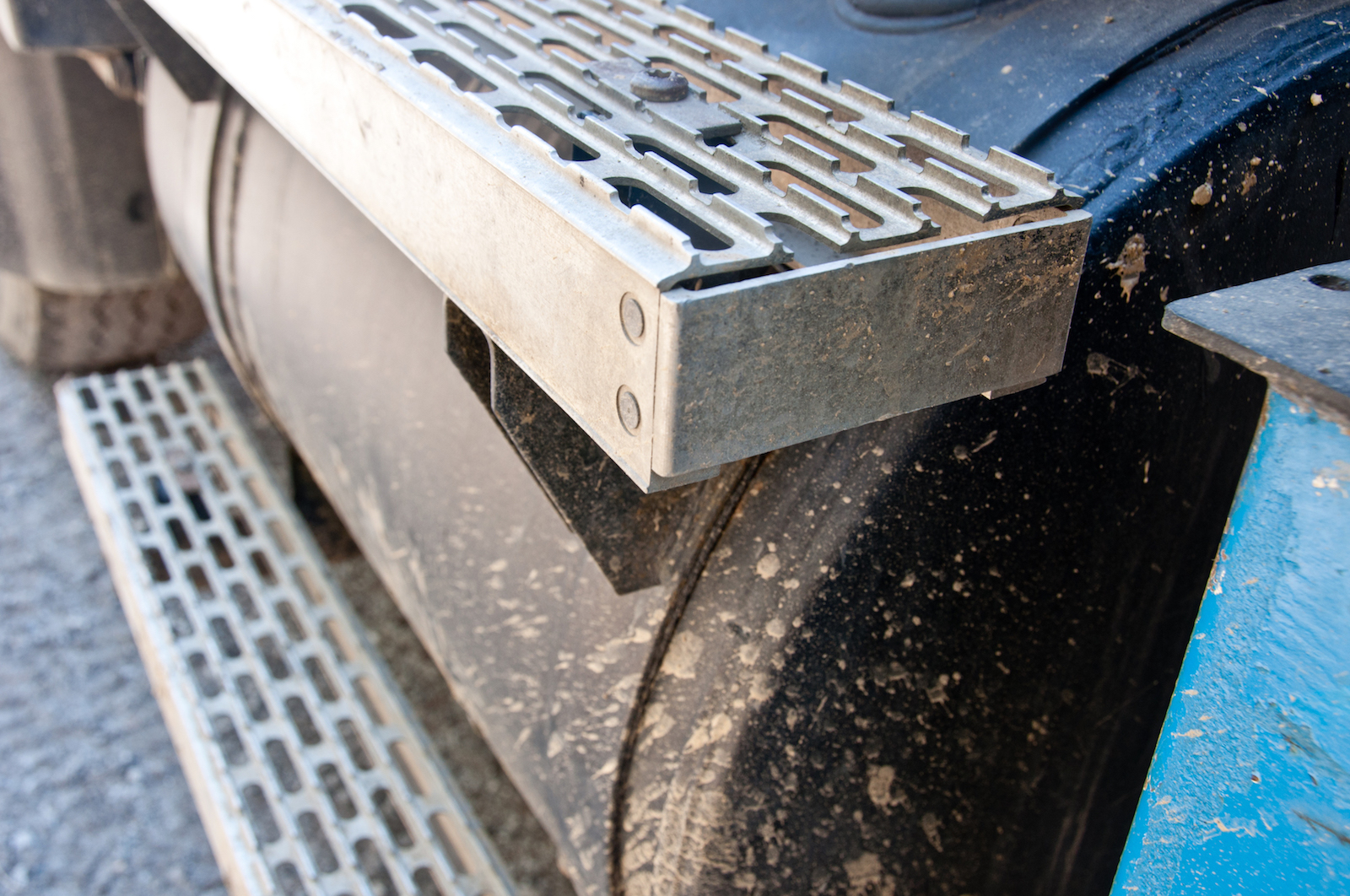 Steps on the side of a truck gas tank